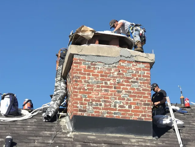 Hollywood Chimney Sweep installing a custom chimney crown in Hollywood, FL